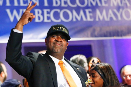 Newark's mayor candidate Baraka makes the victory signal at the Baraka Election Night Party in Newark, New Jersey